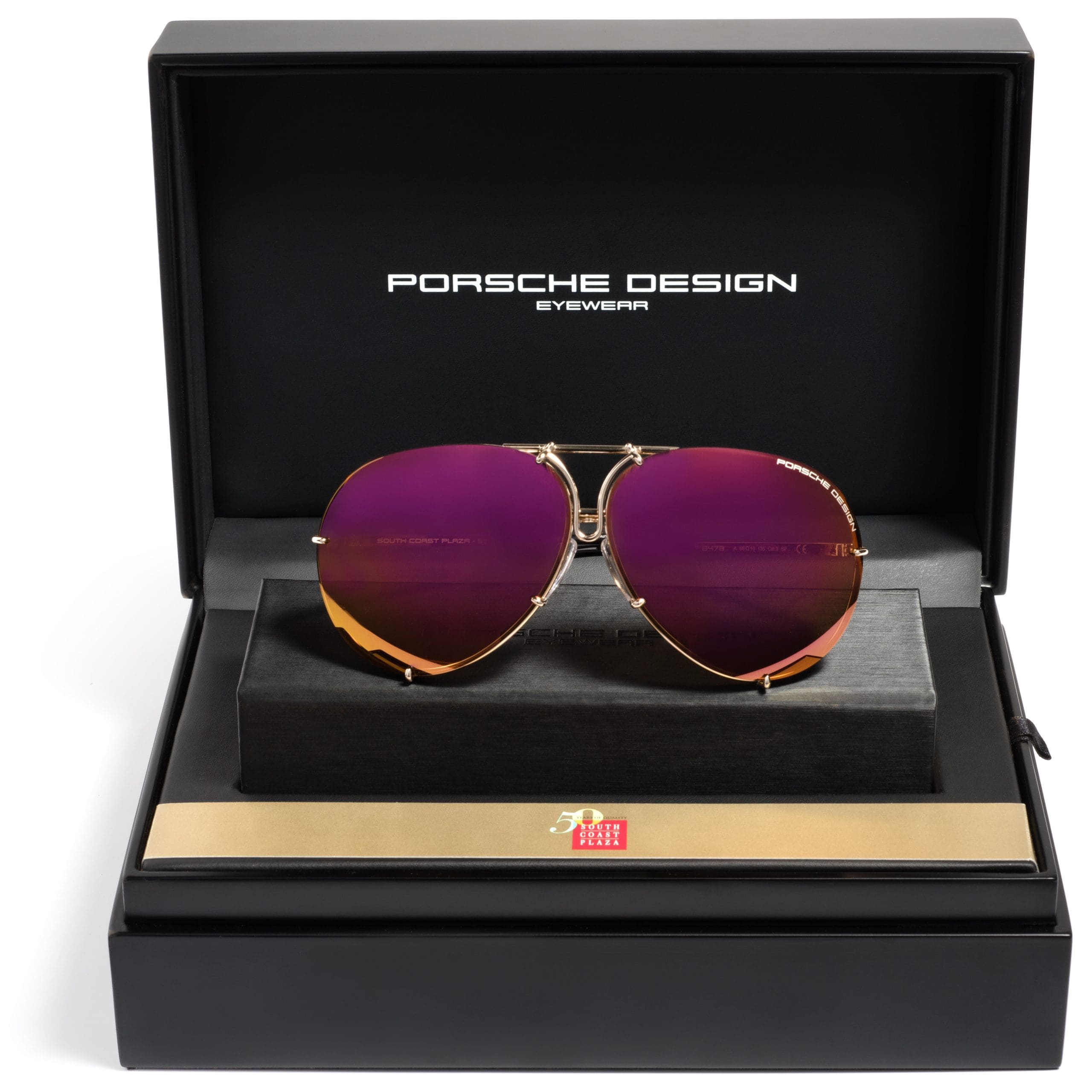 Pair of designer sunglasses in a display box