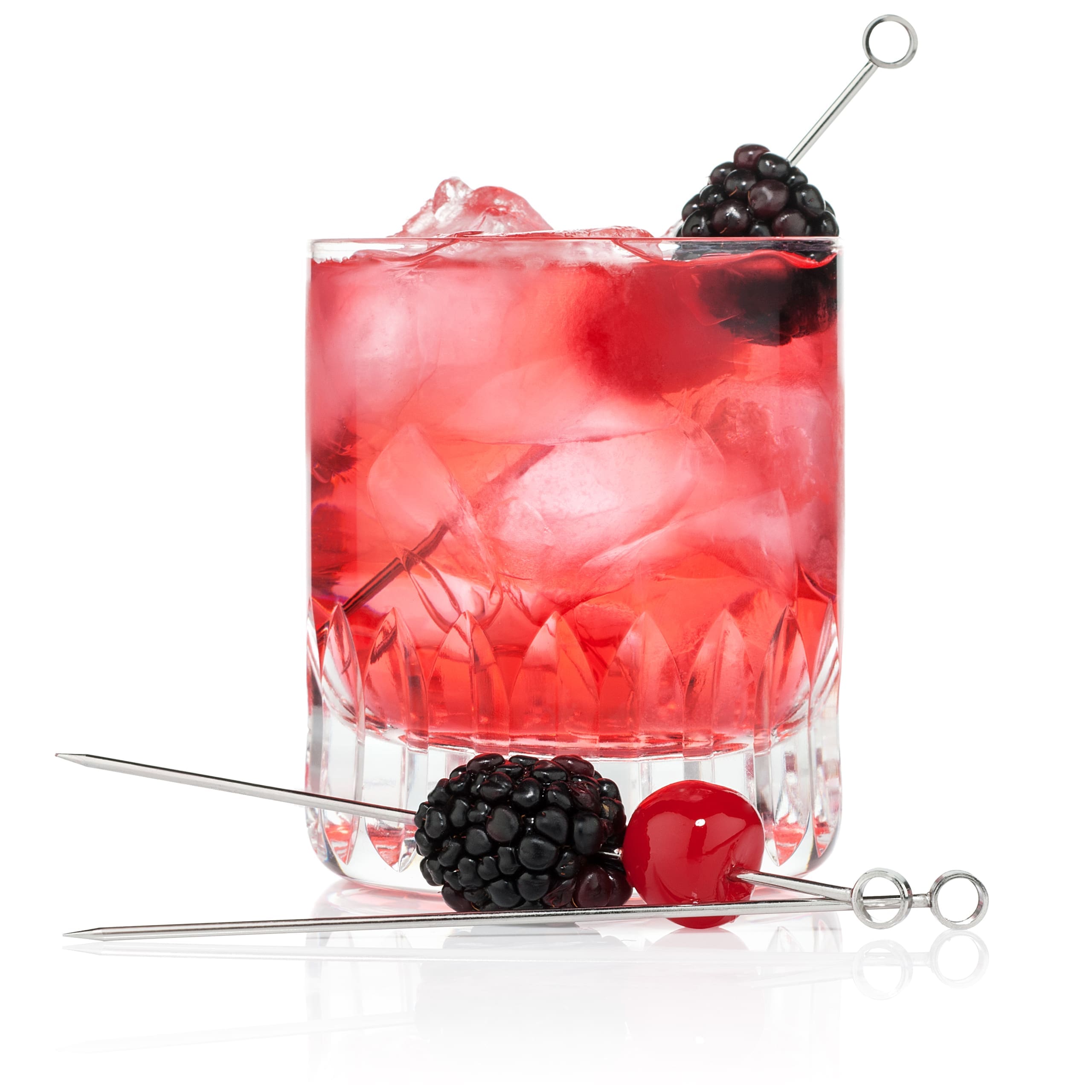Cocktail beverage with red liquid and berry garnishes